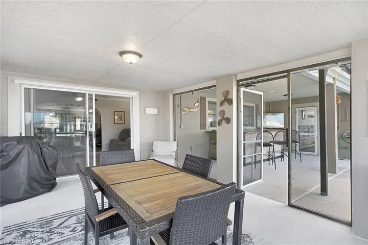 Exterior Dining area featuring a textured ceiling
