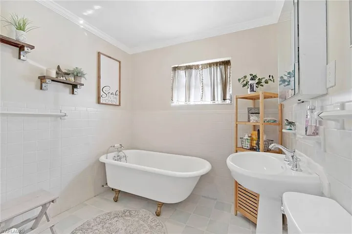Bathroom with tile and bath tub.