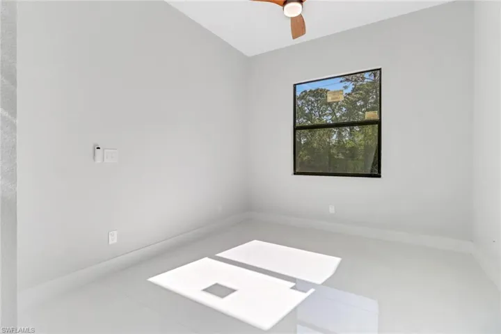 Unfurnished room featuring ceiling fan