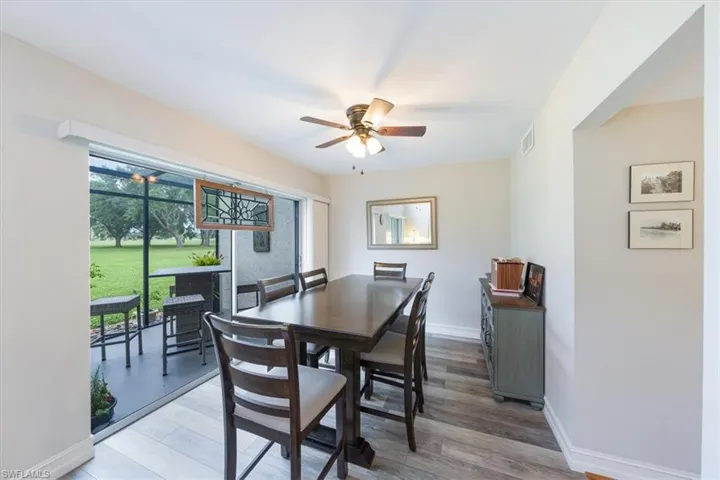 Dining area featuring ceiling fan and light wood-style floors