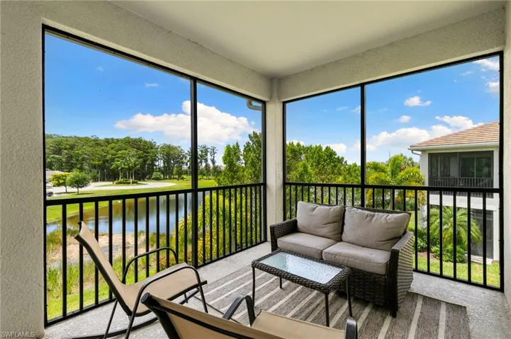 Screened lanai featuring a black metal railing