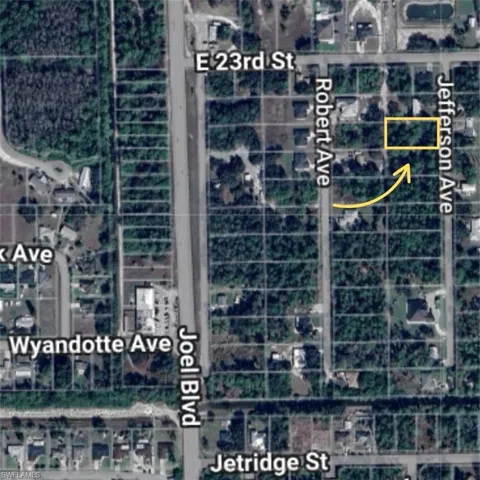 Aerial map of property and surrounding area featuring property parcel outlined