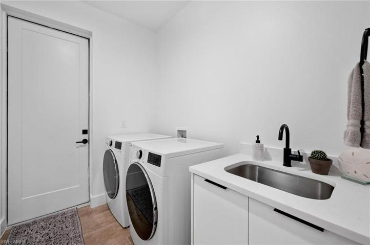 Laundry Room next to the garage with sink