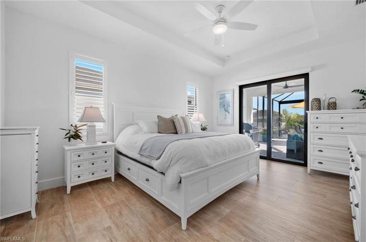 Master bedroom with patio door to the pool area