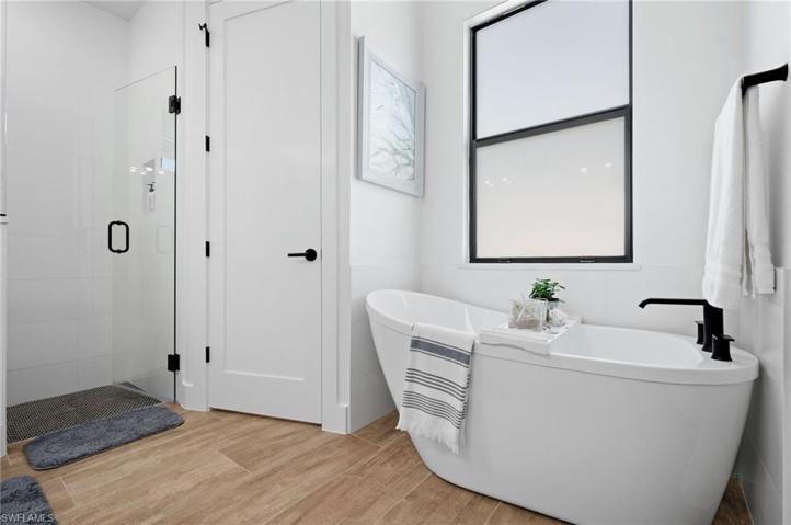 Master bath with tub and shower