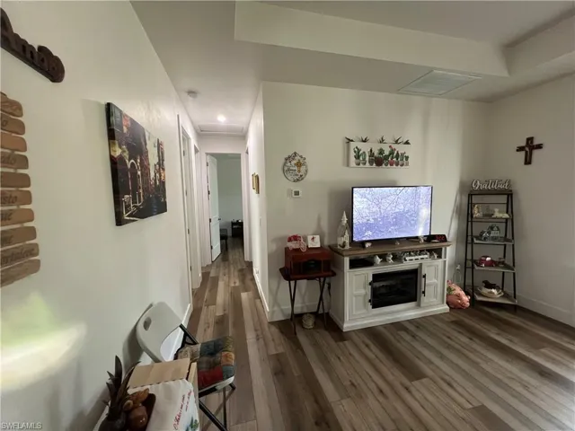Living room featuring dark hardwood / wood-style flooring