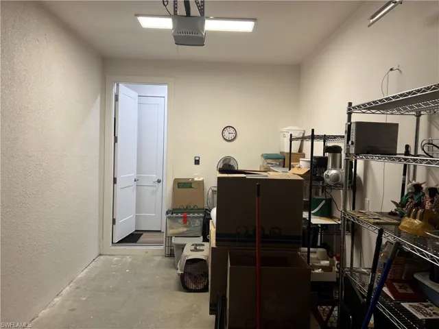 Garage featuring a garage door opener