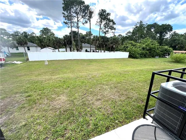 View of yard with central air condition unit