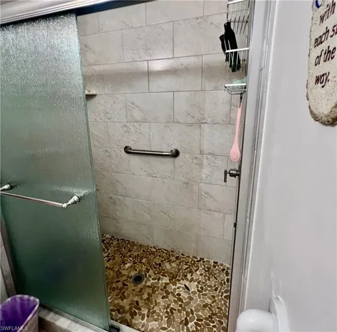 Bathroom featuring a tile shower