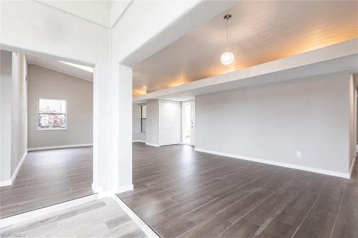 Spare room with wood tiled floors and wood ceiling