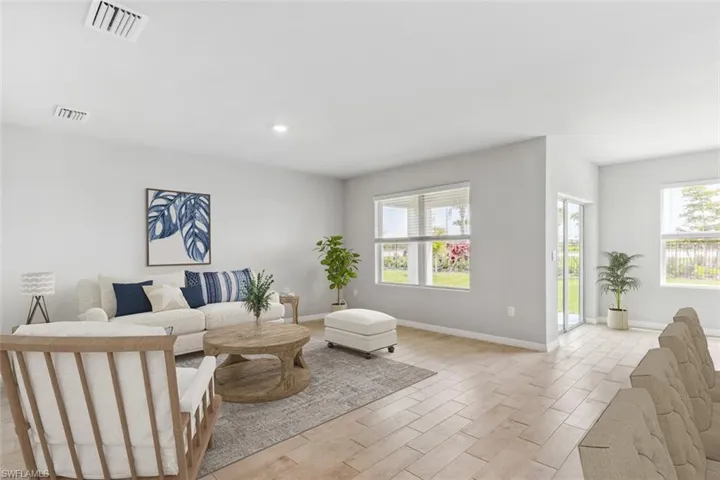 Virtually Staged* Living room featuring light hardwood / wood-style flooring