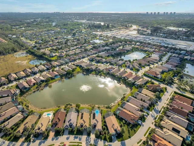 Aerial overview of property's location featuring nearby suburban area and a nearby body of water