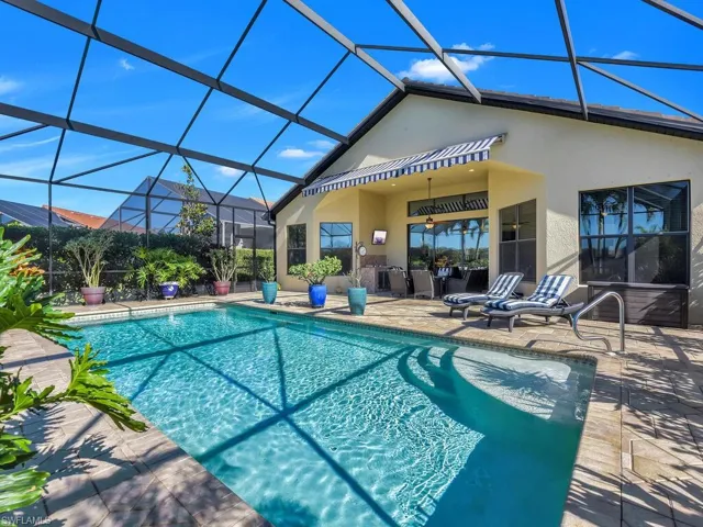 Outdoor pool featuring a patio and a lanai