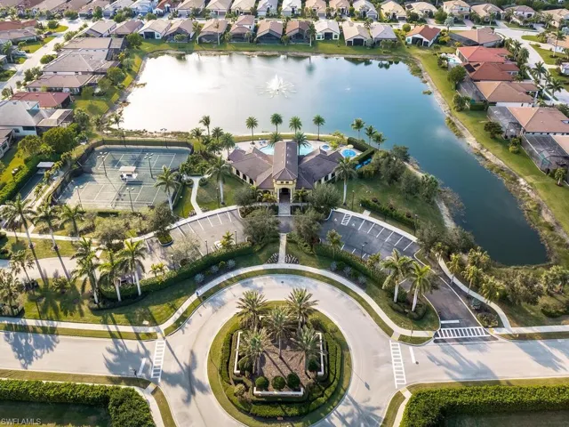 Aerial overview of property's location featuring a nearby body of water and nearby suburban area
