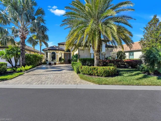 Mediterranean / spanish-style home featuring stucco siding and driveway
