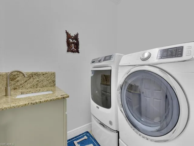 Laundry room featuring separate washer and dryer