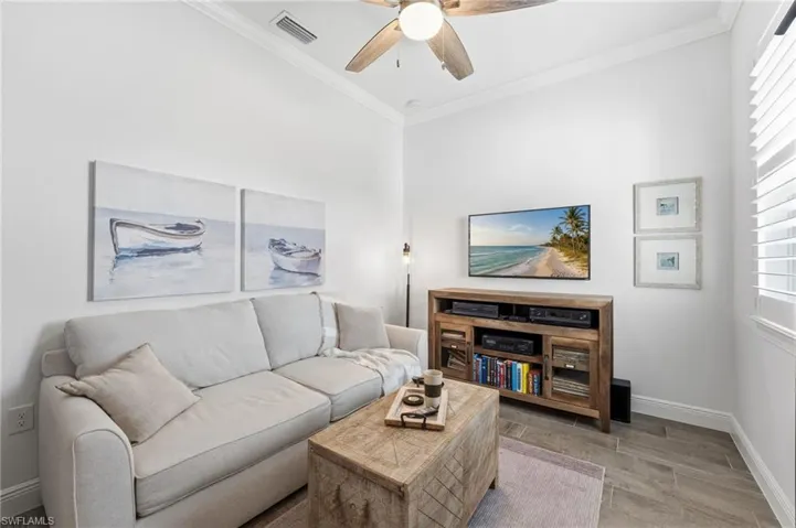 The third bedroom provides a versatile retreat, ideal as a den, office, reading room, or media space—the possibilities are limitless, with natural light spilling in to brighten the space.