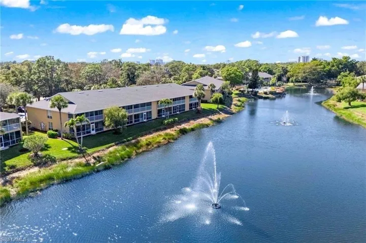 Bird's eye view of a nearby body of water and a tree filled landscape