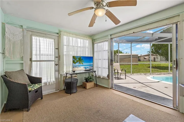 Sunroom / solarium featuring plenty of natural light and a ceiling fan