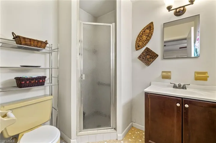 Bathroom with vanity and a stall shower
