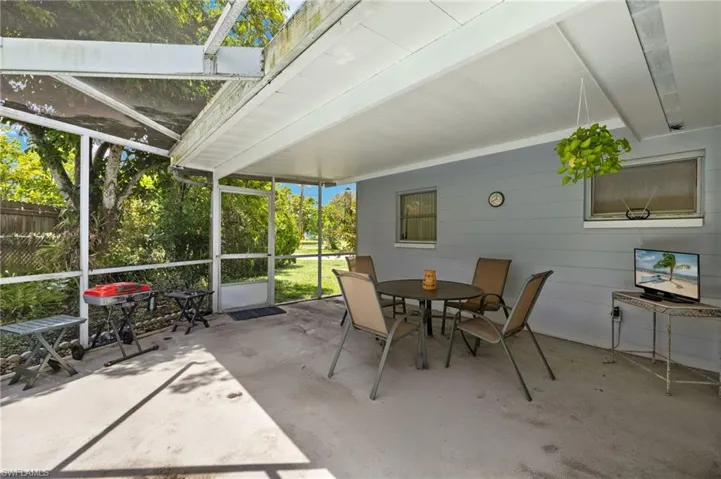 Sunroom with outdoor dining area
