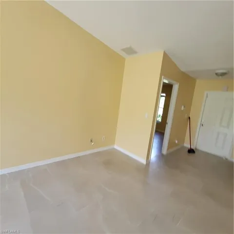 Spare room featuring baseboards