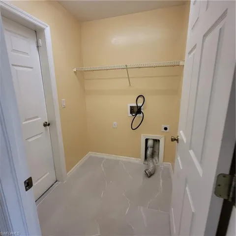 Laundry room with hookup for a washing machine and hookup for an electric dryer