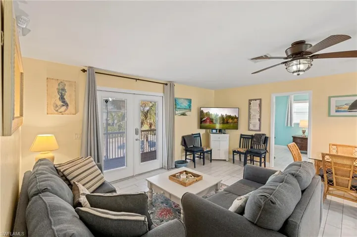 Living room with French doors and ceiling fan