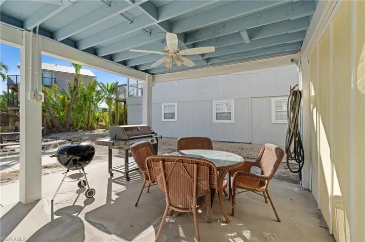 View of patio featuring ceiling fan