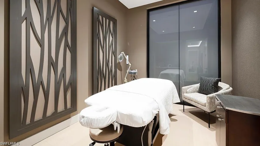 Warm neutral wall paint complemented by two decorative wood-panel wall hangings