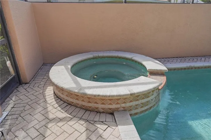 Private courtyard with saltwater pool and spa, connecting the casita and main house
