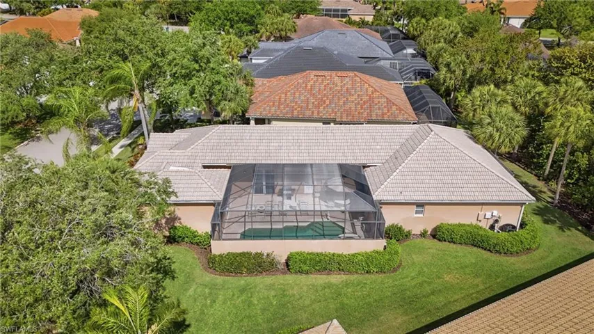 Aerial view highlighting the home’s unique layout and lot size