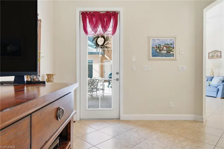 Easy access from the living room to the screened courtyard and pool