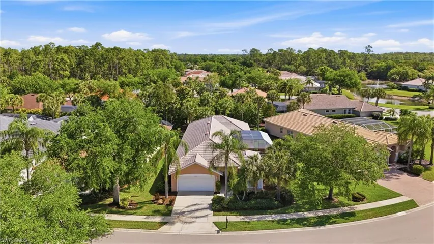 Aerial perspective showcasing the home’s private position within Carlton Lakes