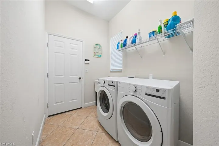 Laundry room with additional storage and everyday convenience