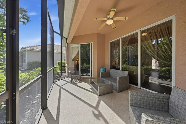 A peaceful screened lanai offering easy access from both the living room and primary bedroom