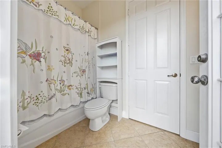 Well-located guest bath with access to nearby bedrooms and the private courtyard