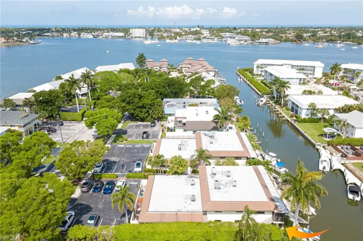 Aerial perspective showcasing waterfront properties with private boat docks