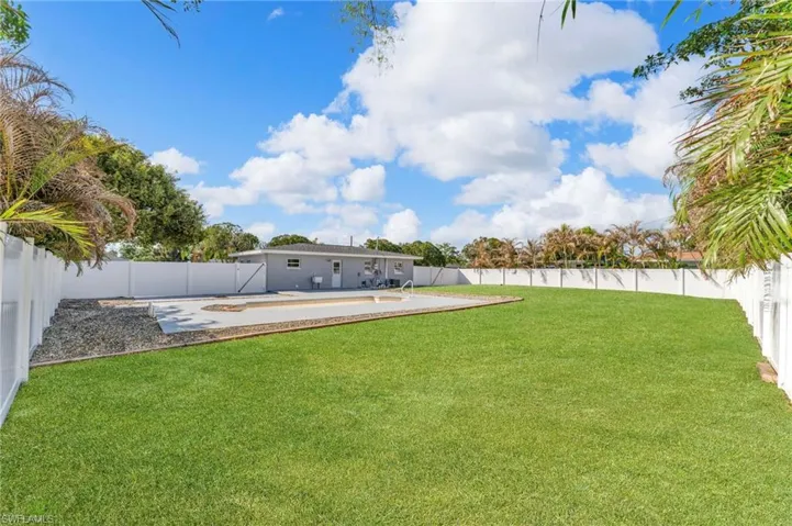Fenced backyard with a patio area