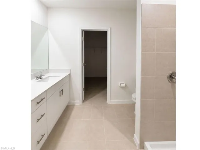 Full bathroom with modern vanity and contemporary finishes.