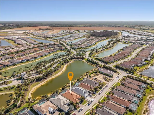 Aerial overview of property's location featuring nearby suburban area