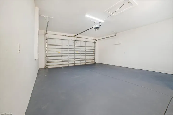 Garage featuring a garage door opener