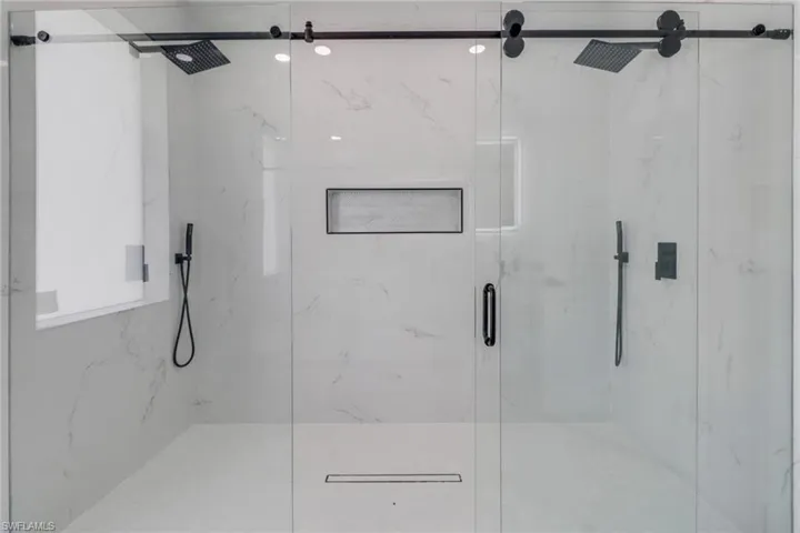 Bathroom with a shower with shower door