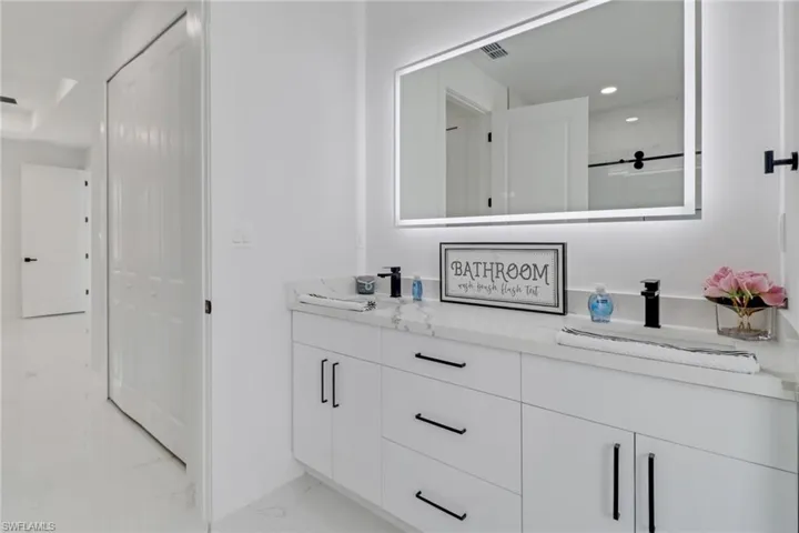 Bathroom with vanity and walk in shower