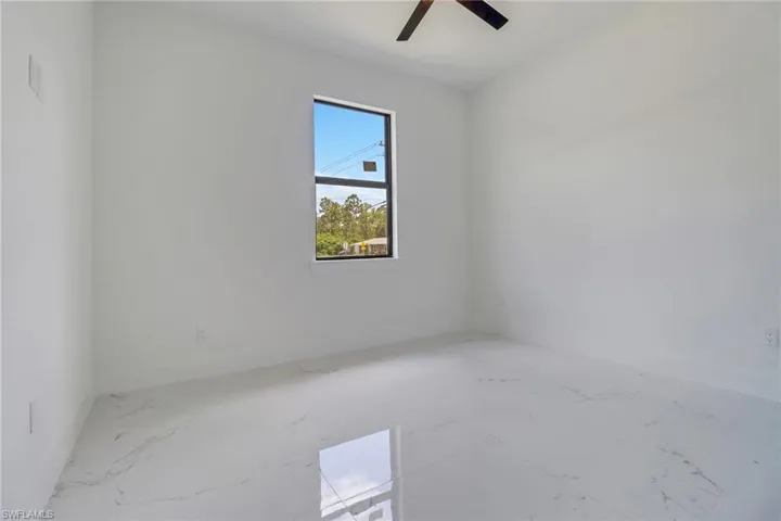 Unfurnished room with ceiling fan