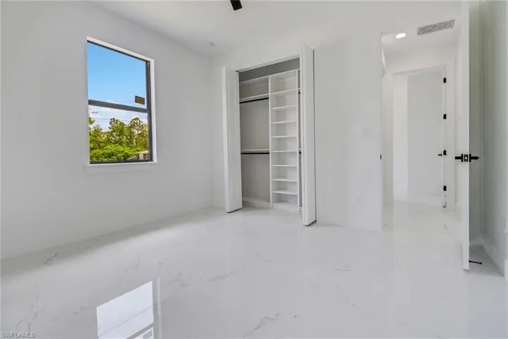 Unfurnished bedroom with a closet and ceiling fan