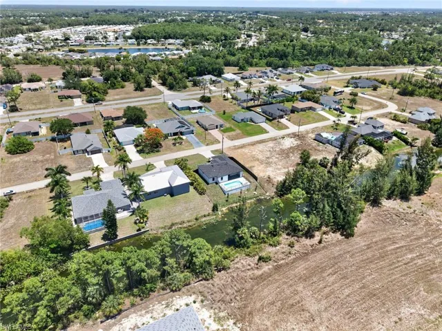 Aerial perspective showcasing a residential area with various single-story homes