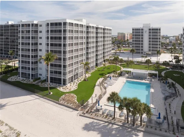View of apartment building / complex with a community pool