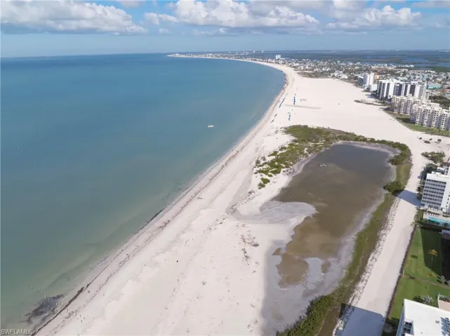 Drone / aerial view of waterfront with a beach