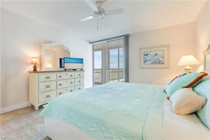Bedroom with access to exterior and ceiling fan